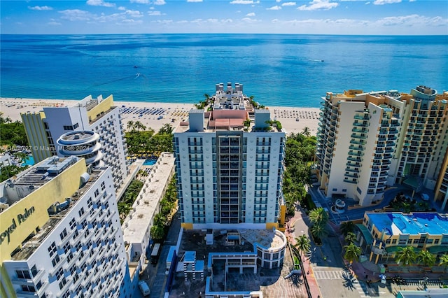 birds eye view of property featuring a water view and a view of the beach