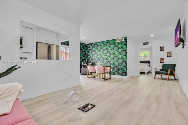 living room with light hardwood / wood-style floors