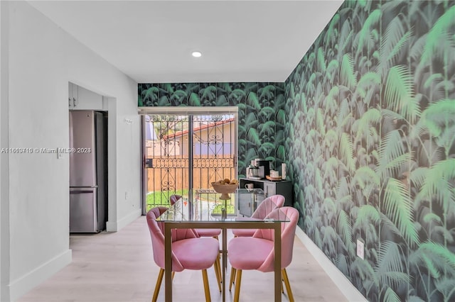 dining space featuring light hardwood / wood-style floors