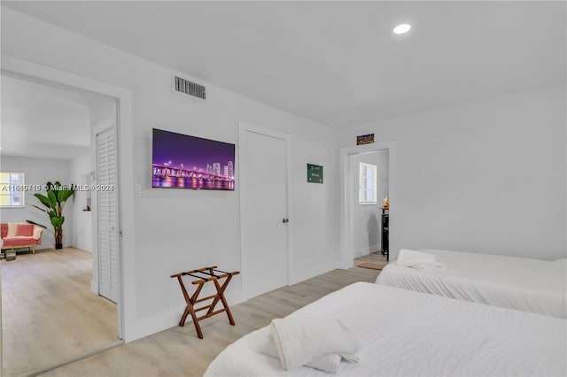 bedroom with light hardwood / wood-style flooring