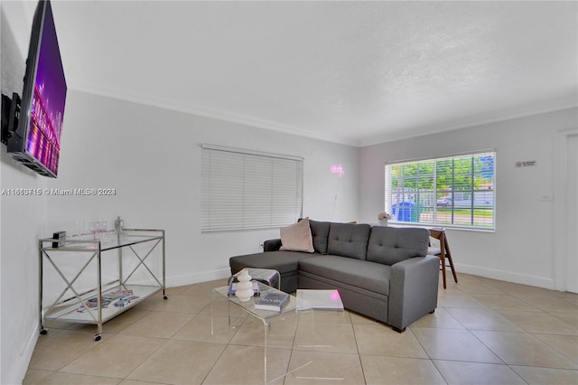 living room with ornamental molding and light tile floors