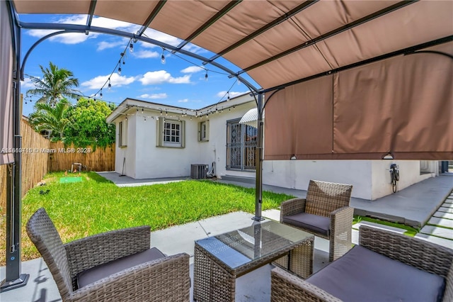 view of patio / terrace featuring central AC, a pergola, and an outdoor hangout area