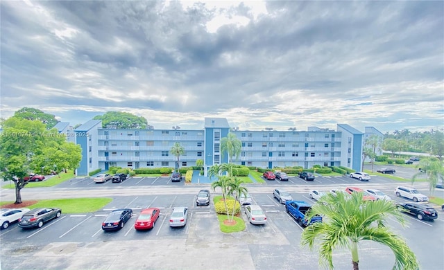 view of property with uncovered parking