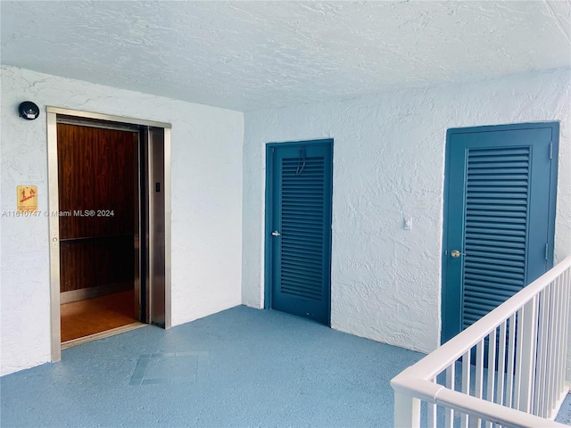 entrance to property with a balcony