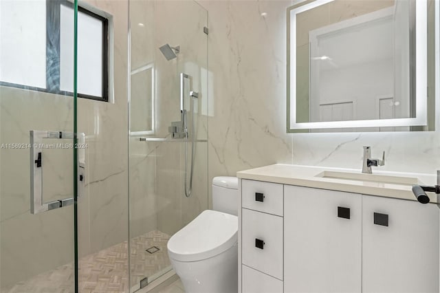 bathroom with tile walls, vanity, an enclosed shower, tasteful backsplash, and toilet