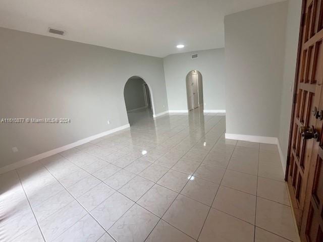 empty room featuring light tile flooring