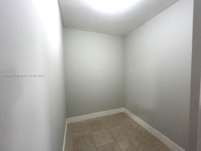 empty room featuring tile flooring