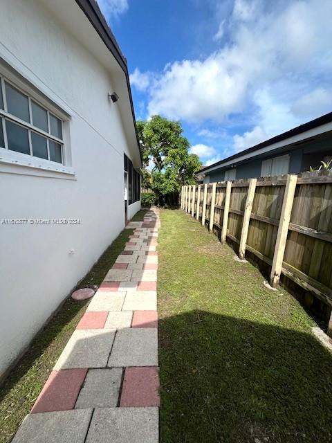 view of yard featuring fence