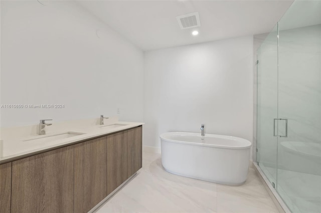 bathroom featuring separate shower and tub and vanity