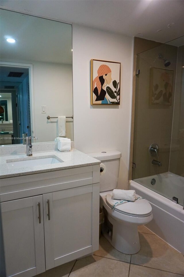full bathroom with shower / bath combination, toilet, visible vents, tile patterned flooring, and vanity
