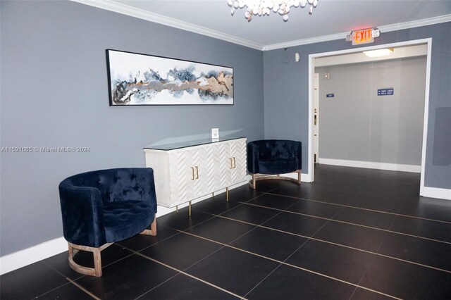 sitting room featuring crown molding, baseboards, tile patterned flooring, and an inviting chandelier