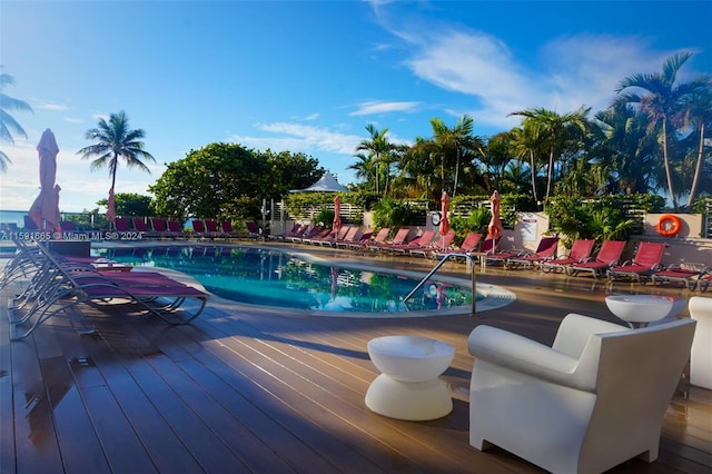 view of swimming pool featuring a deck