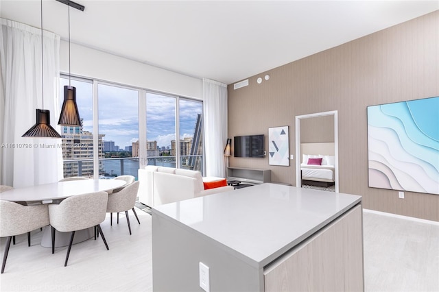 kitchen with a water view and pendant lighting