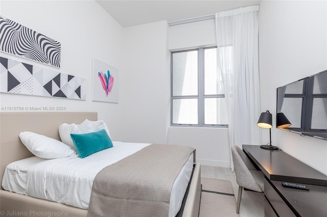 bedroom featuring multiple windows