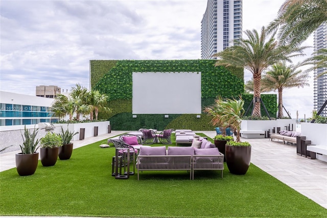 view of yard featuring outdoor lounge area and a patio