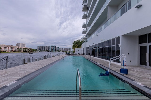 view of swimming pool with a patio