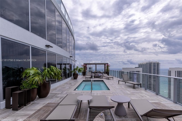 view of swimming pool featuring a patio area