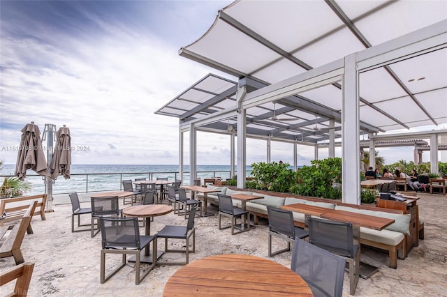 view of terrace with a water view