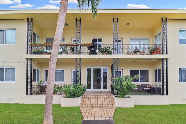 rear view of property with french doors