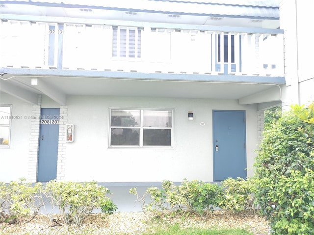 exterior space with stucco siding