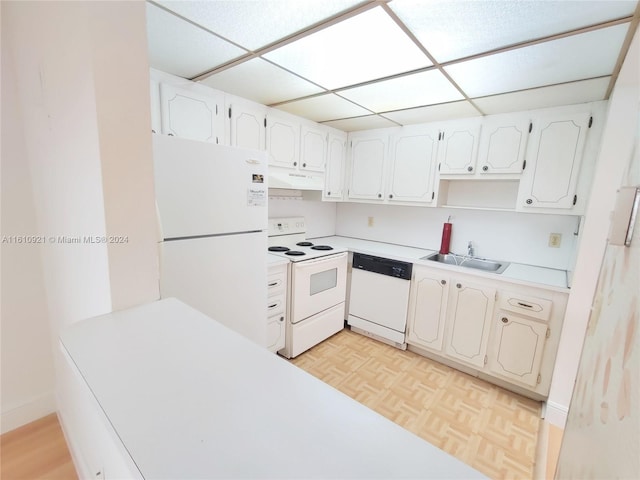 kitchen featuring white cabinets, light parquet flooring, white appliances, and sink