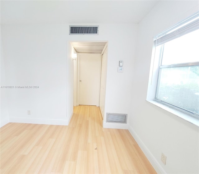 hallway with light wood-type flooring