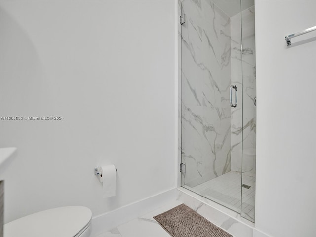 full bath with marble finish floor, baseboards, toilet, and a marble finish shower