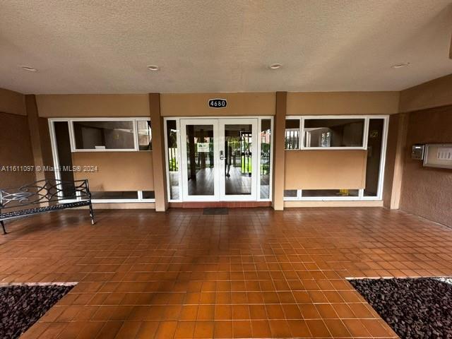 doorway to property featuring french doors