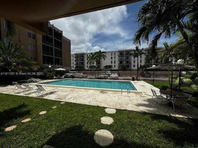 view of swimming pool featuring a patio area