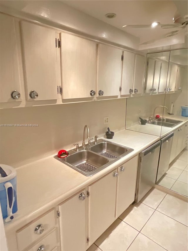 kitchen with stainless steel dishwasher, ceiling fan, light tile patterned floors, and sink