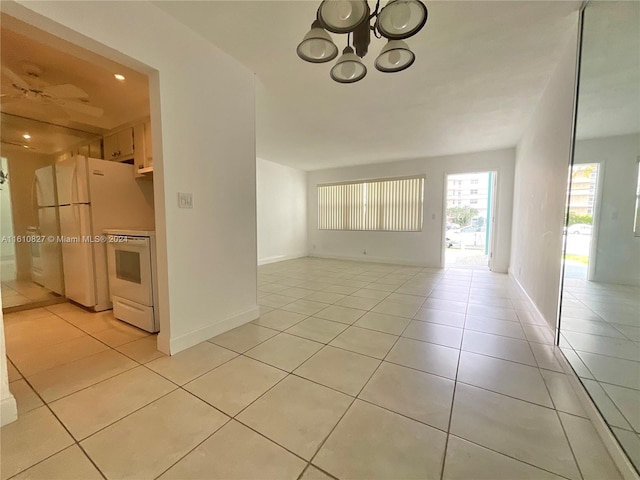 interior space featuring a chandelier and light tile patterned floors