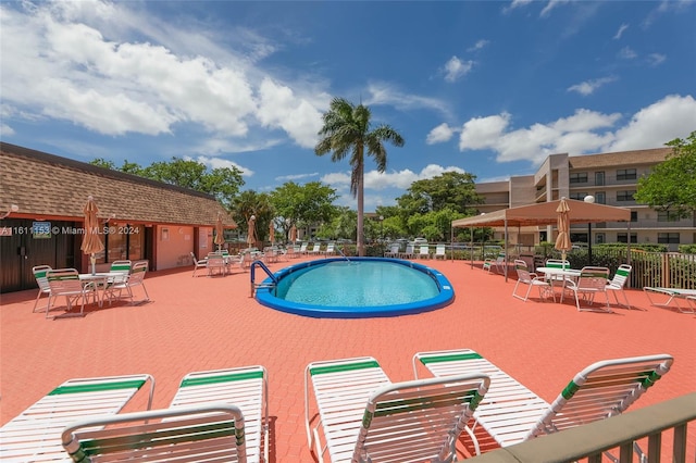 view of swimming pool featuring a patio area