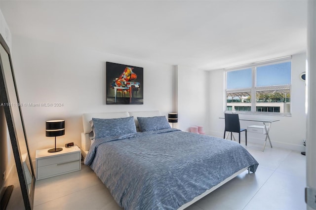 6039 Collins Ave Unit 734, Miami Beach, FL 33140 - bedroom featuring light tile patterned floors