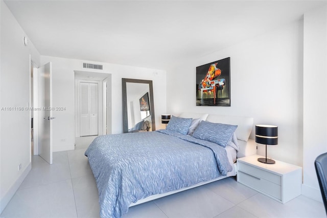 6039 Collins Ave Unit 734, Miami Beach, FL 33140 - tiled bedroom with baseboards
