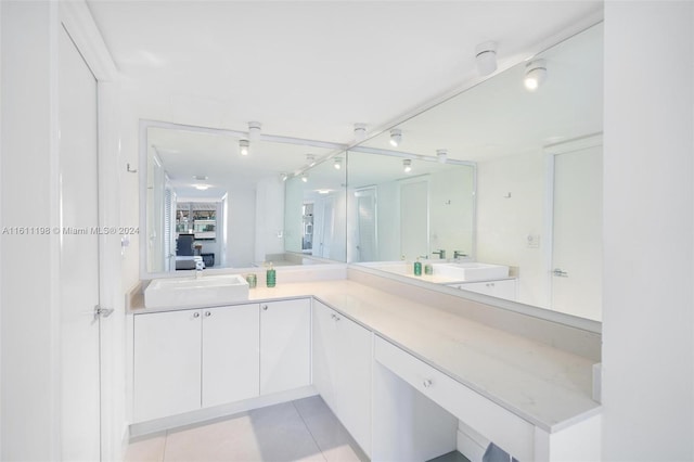 bathroom with tile patterned flooring and vanity