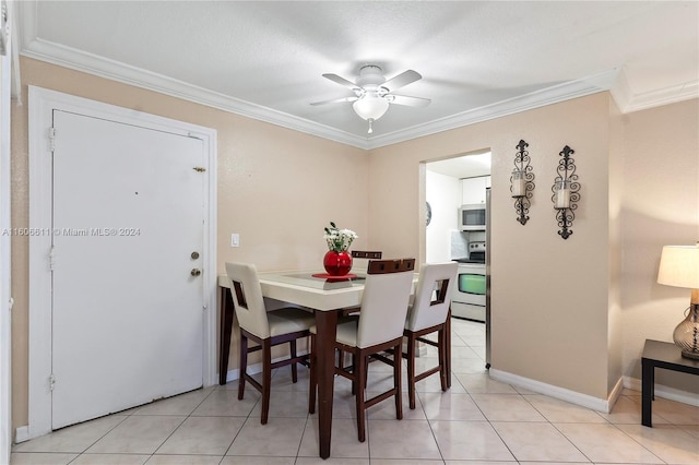 dining space featuring ornamental molding, ceiling fan, and light tile flooring