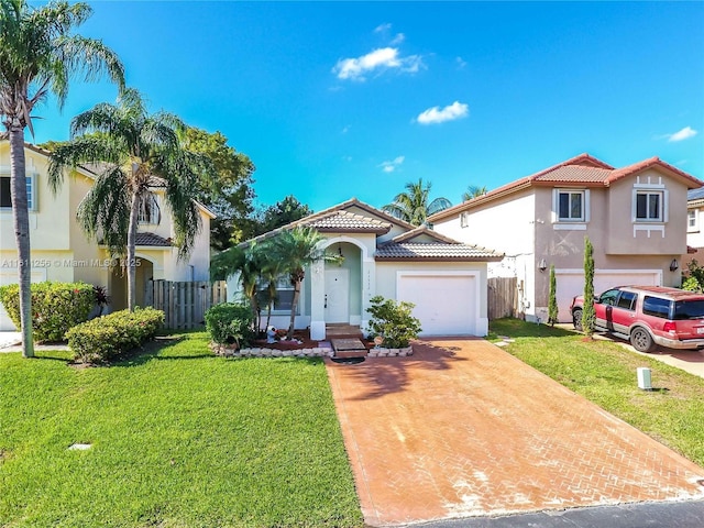 21532 SW 88th Pl, Cutler Bay, FL 33189 - mediterranean / spanish-style house featuring a front lawn, fence, stucco siding, driveway, and a tile roof