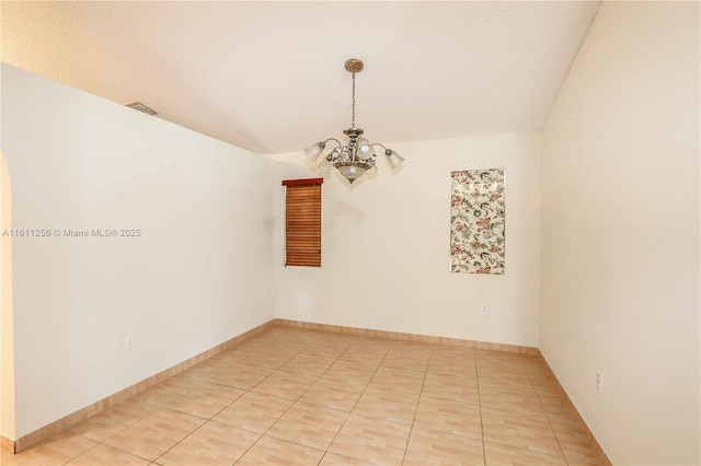 21532 SW 88th Pl, Cutler Bay, FL 33189 - empty room featuring baseboards, an inviting chandelier, light tile patterned floors, and visible vents