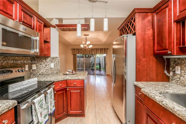 kitchen with light tile patterned floors, stainless steel appliances, a notable chandelier, hanging light fixtures, and light stone countertops