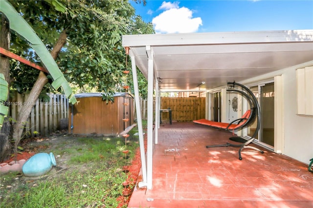 view of patio / terrace with a storage unit