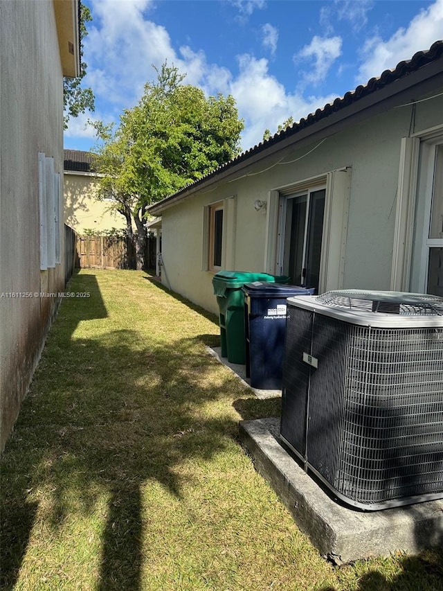 21532 SW 88th Pl, Cutler Bay, FL 33189 - view of yard featuring central AC and fence