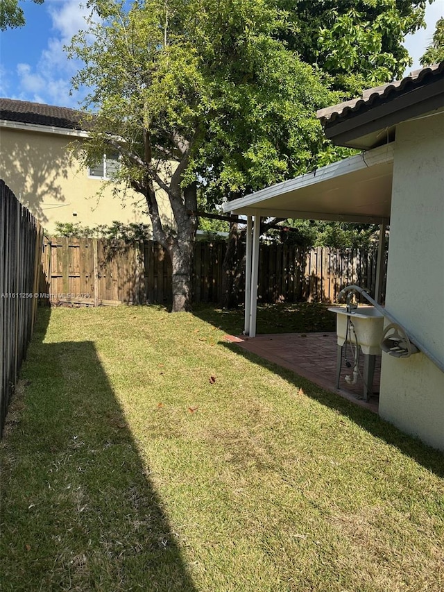 21532 SW 88th Pl, Cutler Bay, FL 33189 - view of yard with a fenced backyard and a patio