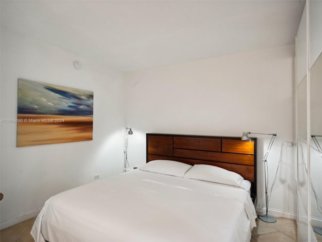 bedroom featuring light tile patterned floors