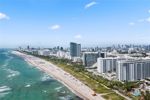 birds eye view of property featuring a view of the beach and a water view