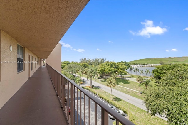 balcony featuring a water view