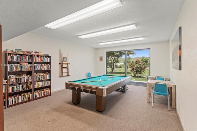 rec room with billiards, carpet, and a textured ceiling