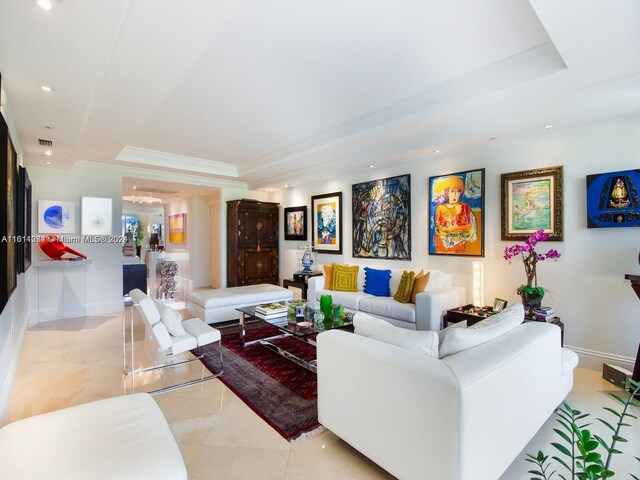 tiled living room with a tray ceiling