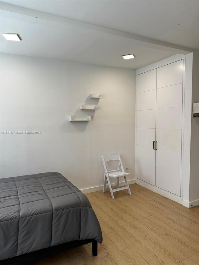 bedroom featuring light wood-type flooring