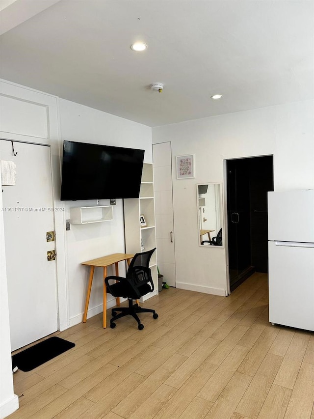 office area with light hardwood / wood-style flooring