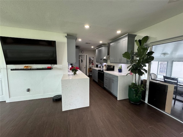 kitchen with gray cabinetry, dark wood-type flooring, black electric range oven, and a textured ceiling